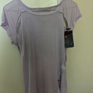 NWT. Nike women’s workout top. Great Condition! Light Purple.